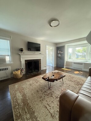 Smart TV, fireplace, books