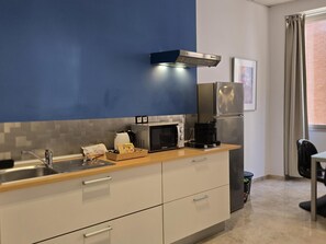 Fridge, microwave, coffee/tea maker, toaster