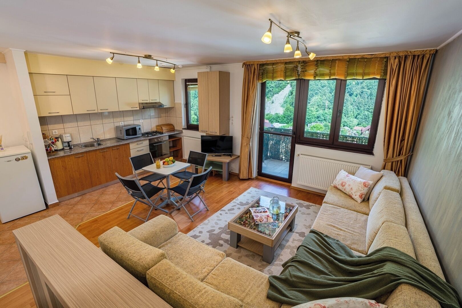 Feel right at home in this open-concept living space where the kitchen, dining, and lounge blend seamlessly — perfect for conversations and family time.