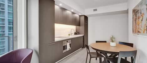 Oven, stovetop, toaster, dining tables