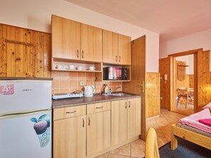 Fridge, microwave, cookware/dishes/utensils