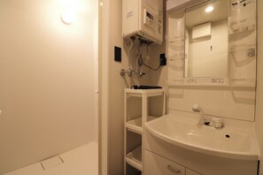 Shower, free toiletries, hair dryer, slippers