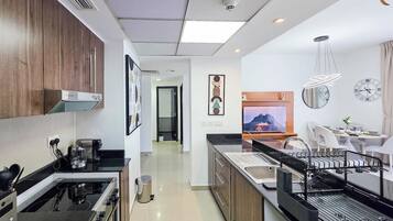 Fridge, microwave, stovetop, coffee/tea maker