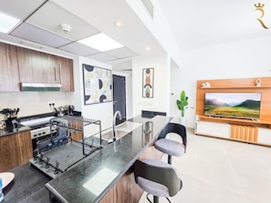 Fridge, microwave, stovetop, coffee/tea maker
