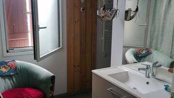 Shower, hair dryer, towels, toilet paper