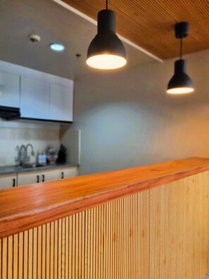 Fridge, microwave, cookware/dishes/utensils, dining tables