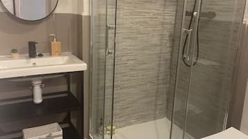 Comfort Double Room, Patio, Garden View | Bathroom | Shower, towels, soap, shampoo