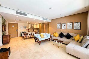 Balanced & Bright 2 BDR @ Mangroovy | Free Pool & Beach Access (M7-6B-14) | Living area | 55-inch Smart TV with cable channels - Xuru Stays I Homestyle 3BR Penthouse Pool & Beach View (El Gouna)