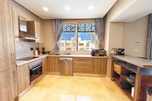 Homestyle 3BR Penthouse | Pool & Beach View (M7-2A-21) | Private kitchen