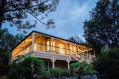 Polished wooden floor Queenslander with big mountain views and U-shaped deck