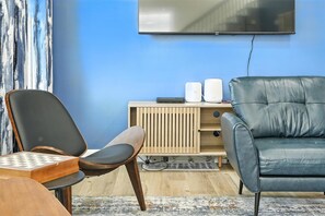 Smart TV, fireplace, table football, books