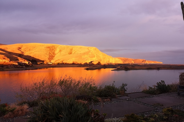 Norwest Arch lighting up the hills.