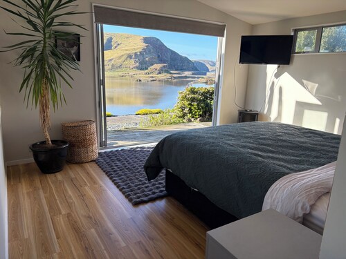 3-bed gem in Birdlings Flat with stunning lake & ocean views – a rare retreat!