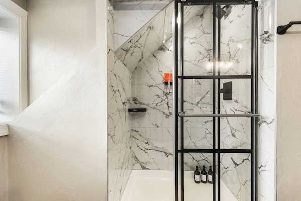 Shower, hair dryer, towels, soap