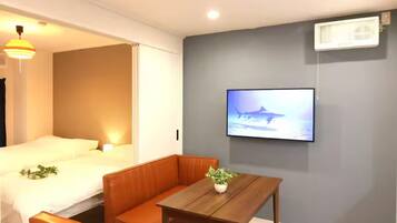 Basic Apartment, City View | Living area | 32-inch flat-screen TV with digital channels