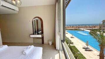 Charming 2 BDR w/ Sea Pool View |Free Pool & Beach (M9-5B-23) | 1 bedroom, iron/ironing board, bed sheets