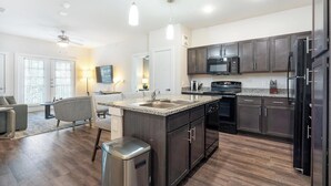 Fridge, dining tables - Landing | Chic 2BD, Pool, Gym (San Antonio)