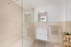 Shower, hair dryer, towels, soap