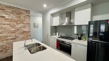 Microwave, oven, dishwasher, dining tables