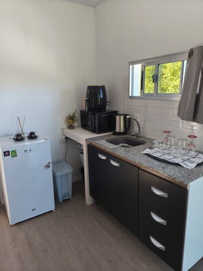 Fridge, microwave, cookware/dishes/utensils, dining tables