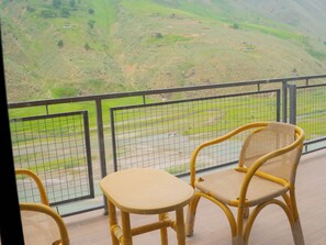 Deluxe Double Room, River View | Desk, laptop workspace, iron/ironing board, free WiFi