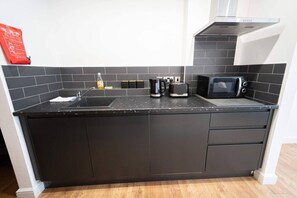 Fridge, microwave, toaster, cookware/dishes/utensils