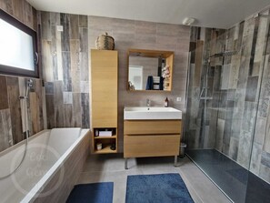 Shower, hair dryer, soap, toilet paper