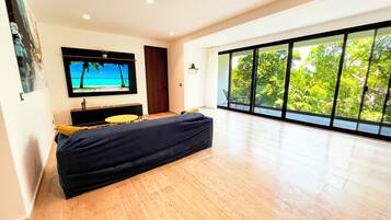 Deluxe Apartment | Living area | 60-inch LED TV with digital channels, Netflix, streaming services