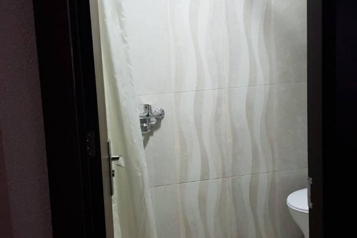 Bathroom | Shower, hair dryer, slippers, towels