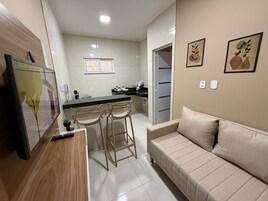 Comfort Apartment | Living area | 43-inch flat-screen TV with digital channels