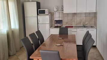 Apartment (Two Bedroom Apartment (1)) | Living room | 32-inch flat-screen TV with cable channels