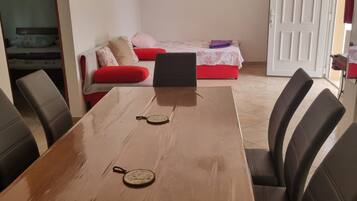 Apartment (Two Bedroom Apartment (1)) | Living room | 32-inch flat-screen TV with cable channels