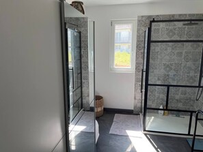 Shower, hair dryer, towels, toilet paper