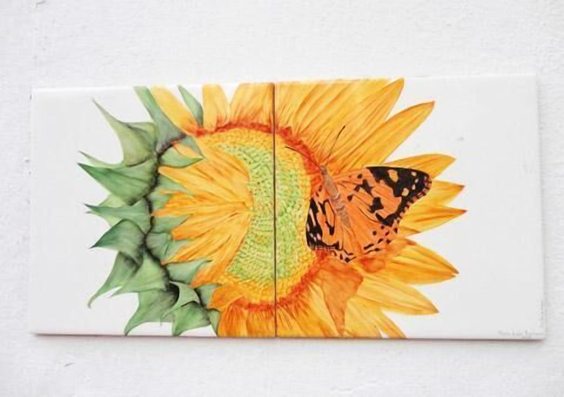 A wall-mounted artwork of a sunflower and butterfly.