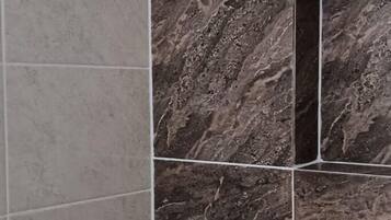 Shower, hair dryer, towels, toilet paper