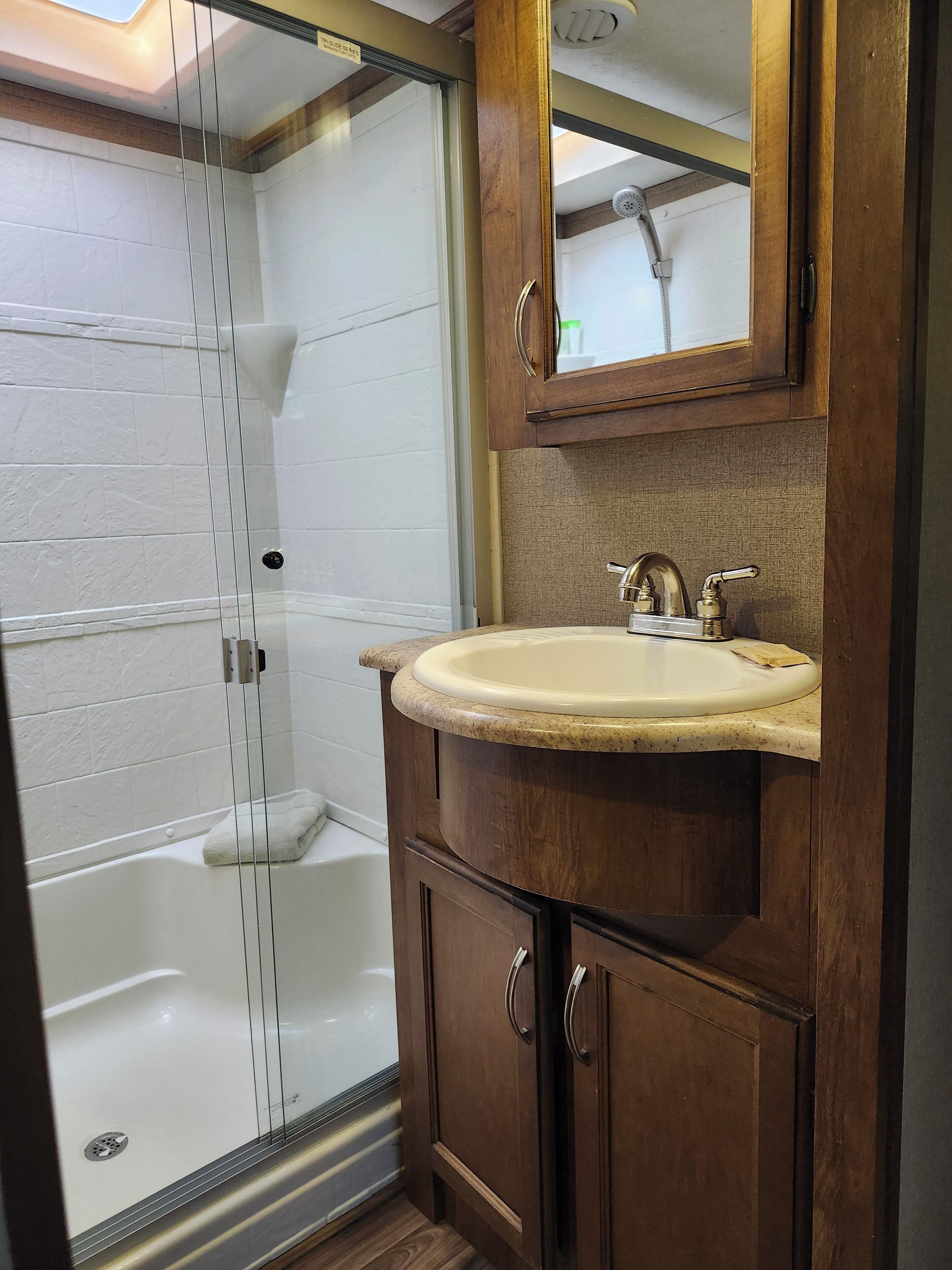 Shower, towels, soap, toilet paper