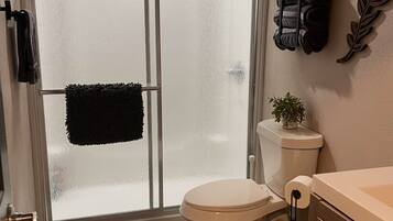 Shower, towels, soap, toilet paper