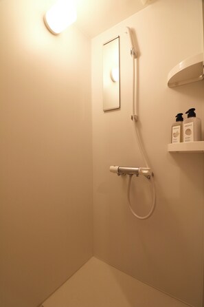 Shower, free toiletries, hair dryer, slippers