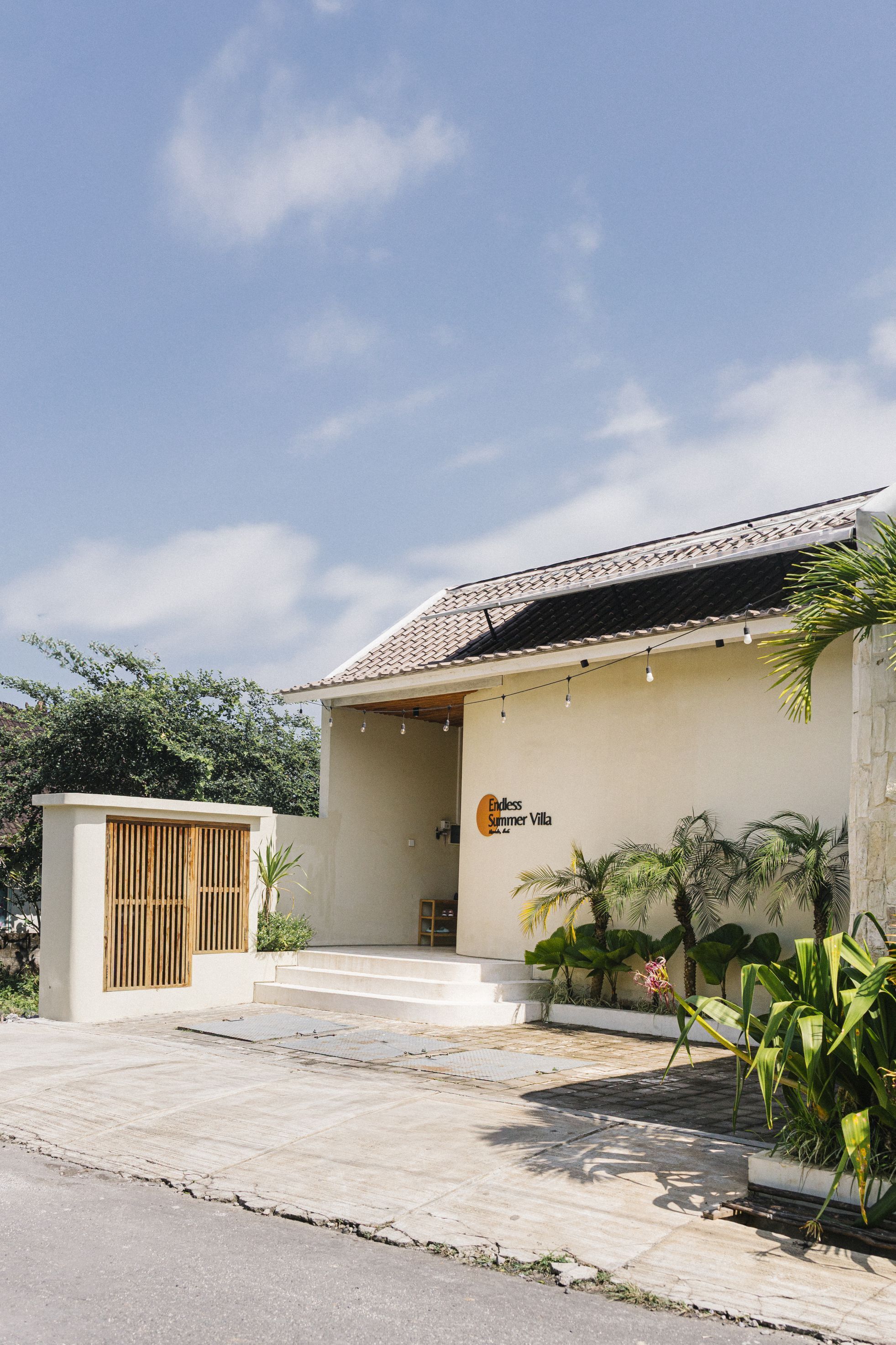 A building with a sign reading "Less Summer Villa."