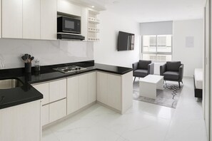 Fridge, microwave, stovetop, coffee/tea maker