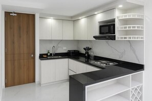 Fridge, microwave, stovetop, coffee/tea maker