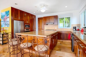 Fridge, coffee/tea maker, cookware/dishes/utensils