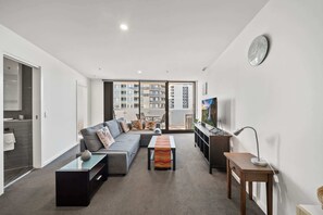 TV, offices - Light-Filled 1-Bed Apartment with Pool & Gym (Gungahlin)