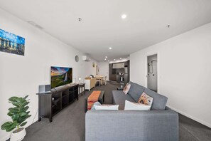 TV, offices - Light-Filled 1-Bed Apartment with Pool & Gym (Gungahlin)