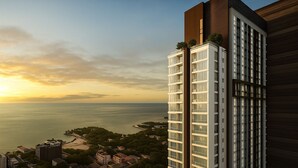 Un immeuble de grande hauteur doté d’une architecture moderne, caractérisé par une section verticale imposante et un jardin sur le toit.