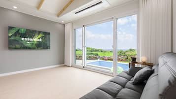30PY Private Pool Villa | Living area | 66-inch LED TV with cable channels