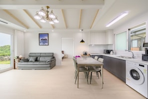 30PY Private Pool Villa | Living area | 66-inch LED TV with cable channels