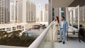 Departamento Deluxe, balcón, vista al lago | Área de sala de estar | Smart TV de 50 pulgadas con canales digitales 