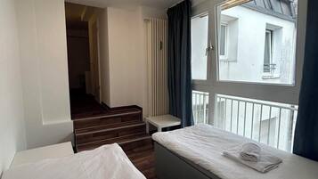 Twin Room | Individually furnished, iron/ironing board, free WiFi, bed sheets