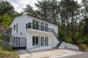 Exterior - Candida Apartment with Mountain Views, Shared Garden, and Air Conditioning (San Cosme-Outes)
